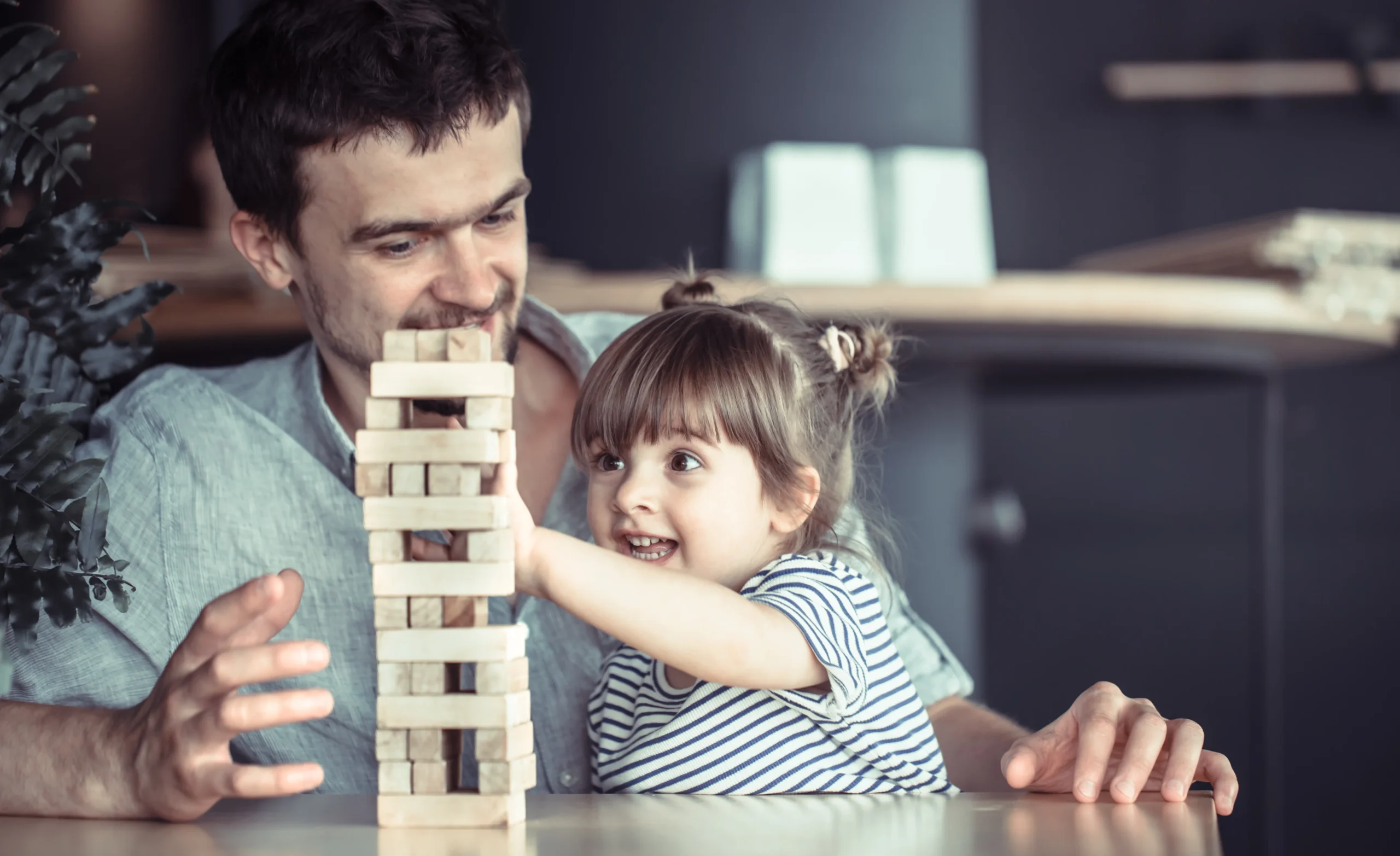 Father and daughter playing together, symbolizing the importance of emotional connection and how gentle parenting affects child development.