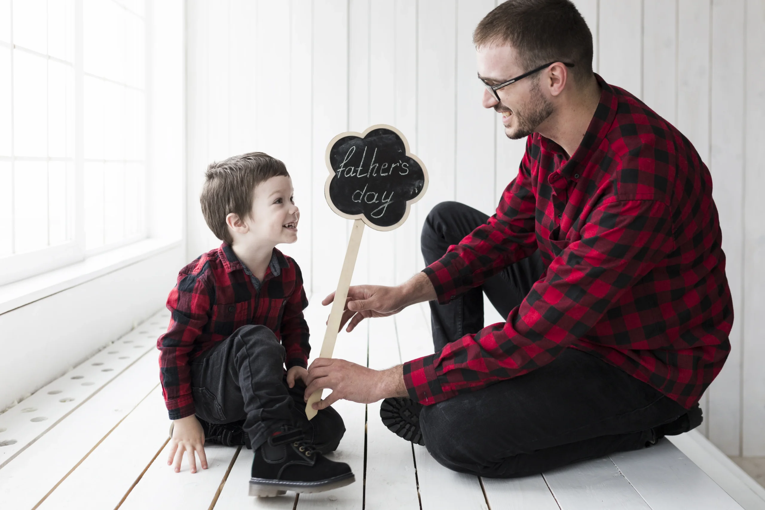 Father and son celebrating Father’s Day, representing the impact of positive parenting and emotional connection on how gentle parenting affects child development.