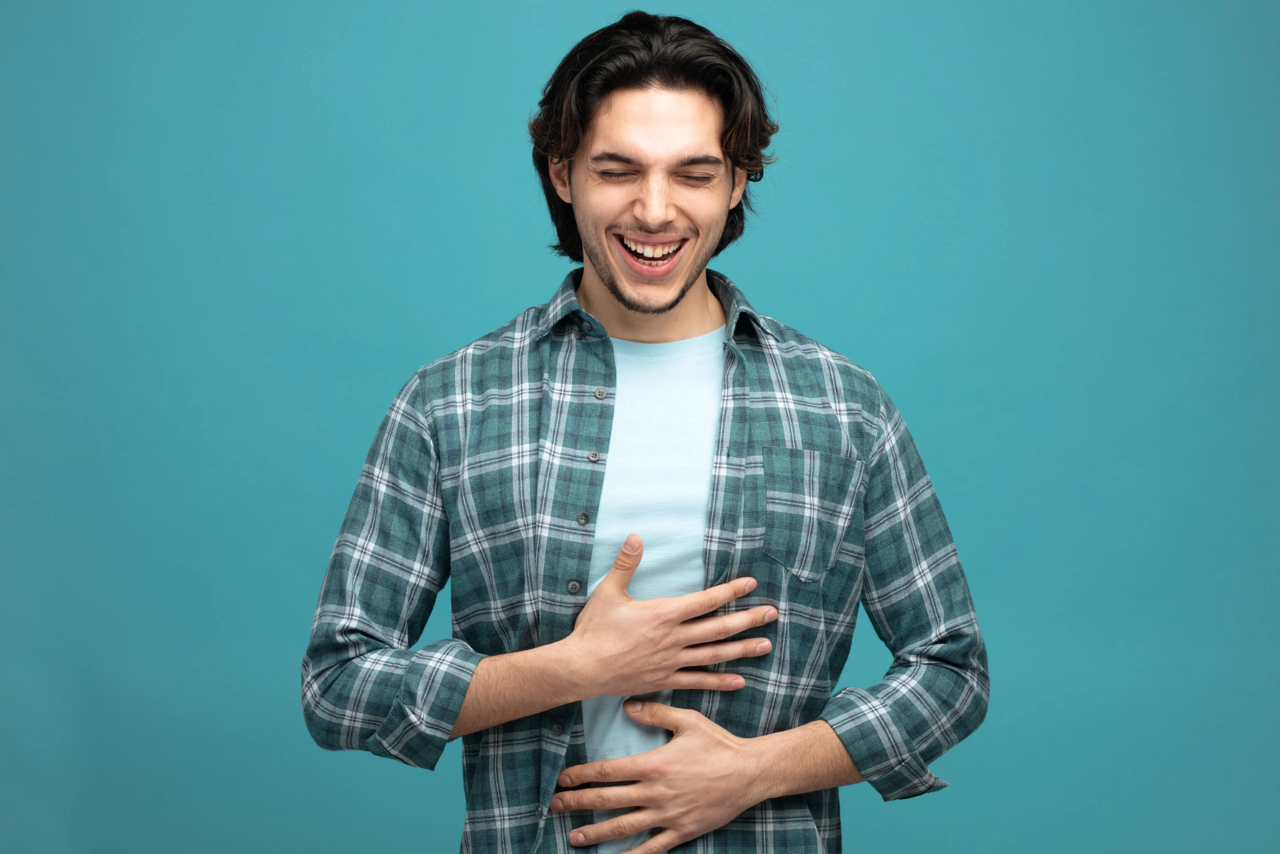 how to have healthy gut bacteria naturally for better digestion and gut health shown with happy man holding stomach indicating good digestive health