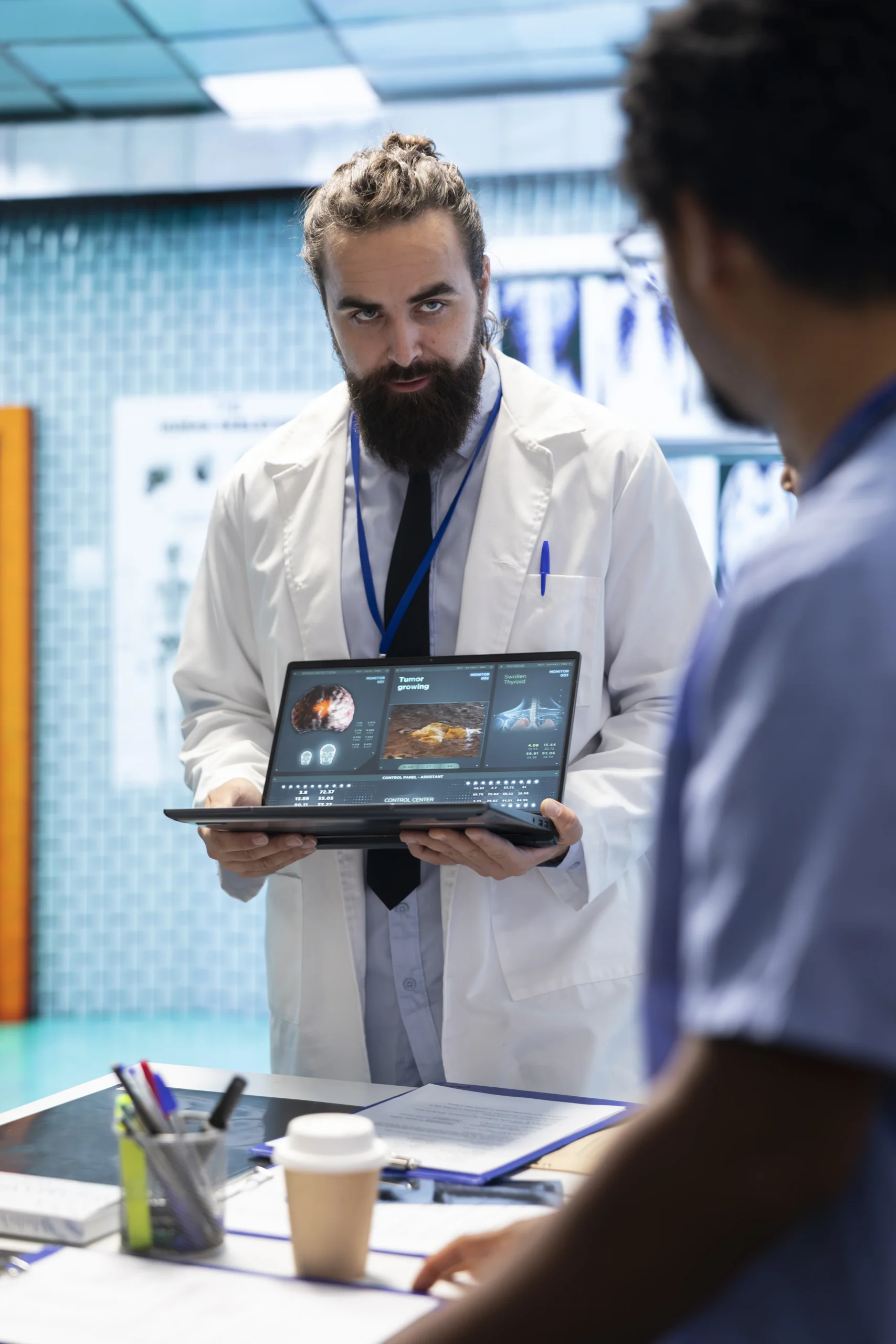 "Neuroscience expert reviewing MRI brain scan results on a laptop, highlighting the rise of digital health and how technology is transforming medical diagnostics."