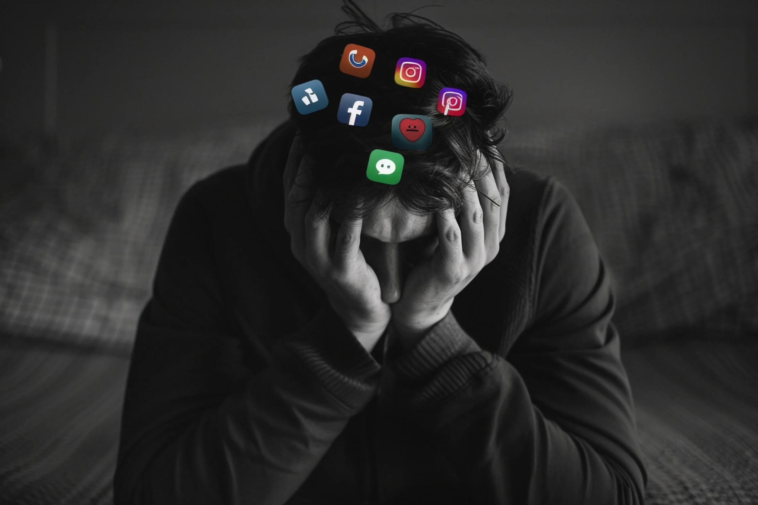 Stressed man holding his head with social media app icons above him, illustrating the impact of social media and mental health.